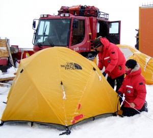 Jeff Hoffman and Abigail Noble set up tents