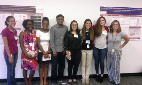 GSP interns Emily Samuels, Rolande Tra Lou, Erica Ngouajio, Raja Venkatappa (mentor), Claudia Najera, Kat Rocha, Tayah Bolt (from La Jolla) and Kenya Platero gather at JCVI Rockville's poster session.