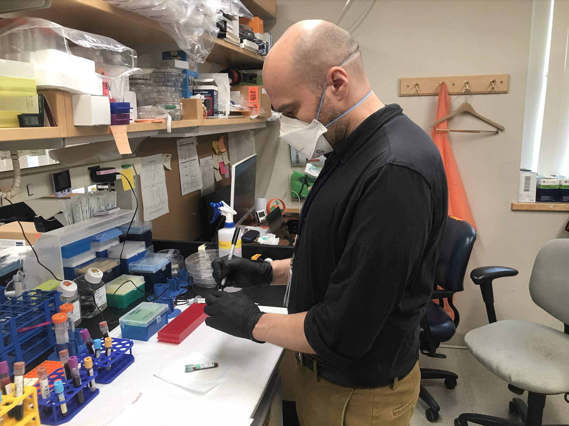 Researcher in lab at bench.